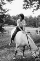 Kennedy, Jackie Rides White Horse, Looking Right, 1963
