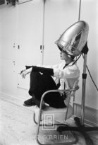 Audrey Hepburn Under the Dryer Holding Cigarette Side View, 1953