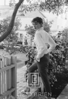 Audrey Hepburn strolls in front of her Beverly Hills apartment, 1953