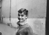 Audrey Hepburn in Grey Turtleneck Sweater, Glances Left, Smiling, 1953