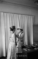 Coco Chanel Arranges Jewels on her Assistant, 1957