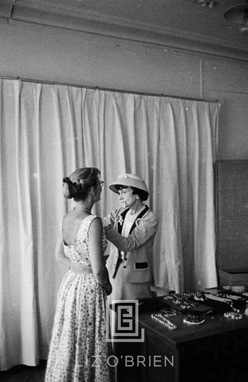 Coco Chanel Arranges Jewels on her Assistant, 1957 by Mark Shaw