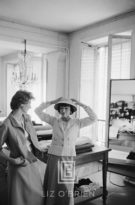 Coco Chanel with Suzy Parker Discusses New Designs, 1957