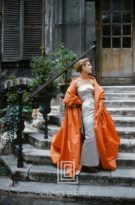 Givenchy Rust Cape in Courtyard, 1955