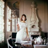 Designer's Homes, Model wears White Goma in Henry Samuel's Home, 1960