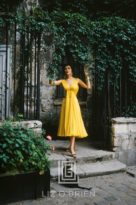 Desses Yellow Chiffon in Courtyard with Black Cat, 1955