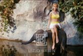 Swimsuit Model at Disneyland with Baby Elephant, 1964