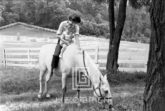 Kennedy, Jackie and Caroline on Horse, 1959