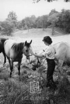 Kennedy, Jackie with Two Horses, 1959