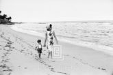 Kennedy, Jackie and John Jr. Walking on the Beach, 1963