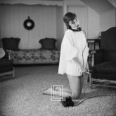 Audrey Hepburn in White Blouse with Phone, Kneeling, 1953
