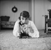 Audrey Hepburn in White Blouse with Phone, Laying, Hand on Receiver, Chin Down, 1953