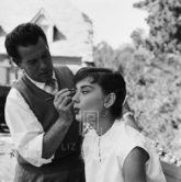Audrey Hepburn gets a last minute touch up from Wal on the set Sabrina, 1953
