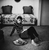 Audrey Hepburn in Striped Sweater Lounges, Arms Back, 1953