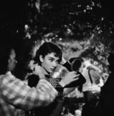 Audrey Hepburn Under Tree Touches Up Makeup, 1953