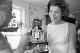 Kennedy, Jackie shopping in Georgetown Admires Doll